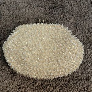 Small little coin purse with white beads made in Hong Kong